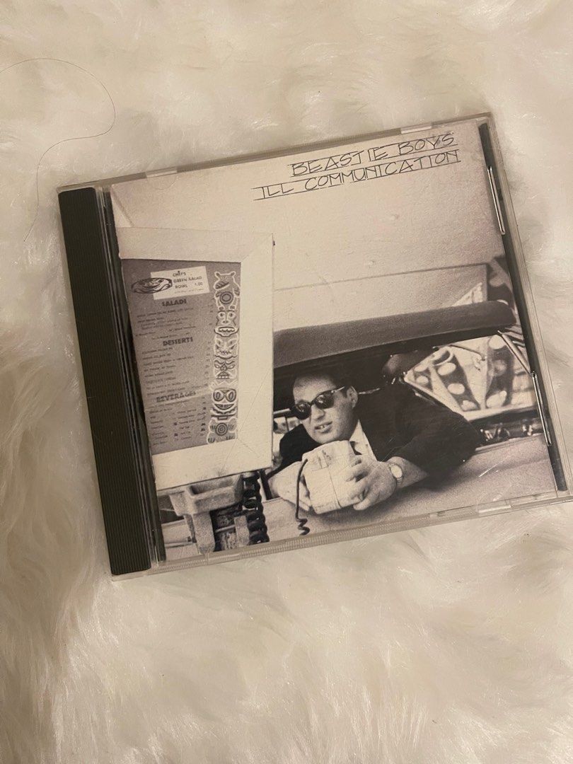 Beastie Boys Ill Communication CD NM (Category: CDs & DVDs) located in Pasig City. Submitted by vr1998 (Listing ID 1407715791, Image 1). Description: - Original "Ill Communication" CD by Beastie Boys. - Includes CD case and disc. - Features hit tracks like "Sabotage" and "Sure Shot". - Back of case shows tracklist and band photo. - A Grand Royal production..