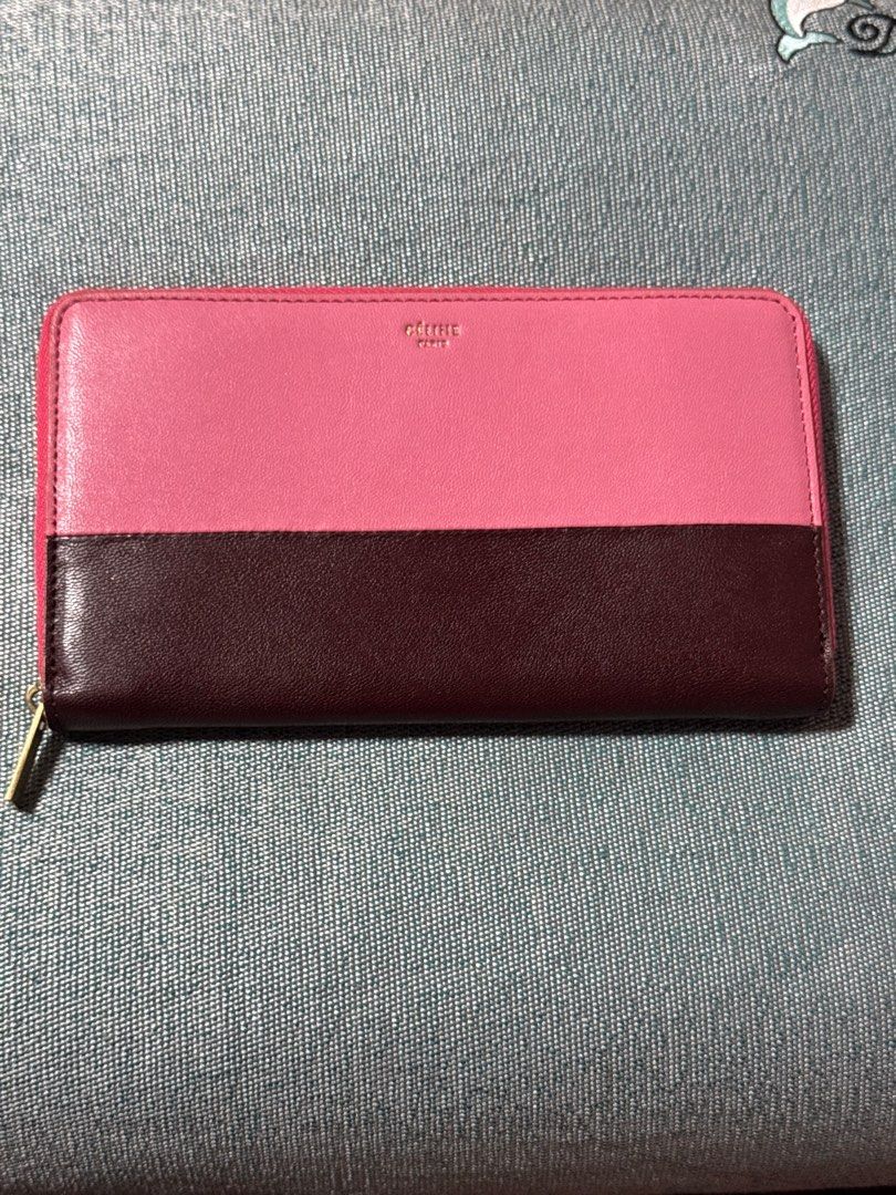 Celine Bi-Color Zip Around Wallet (Category: Luxury Bags & Wallets) located in Davao. Submitted by emeraldjecko (Listing ID 1407582939, Image 1). Description: - Authentic Celine wallet - Bi-color design: Pink and brown leather - Zip-around closure with gold-tone zipper - Interior: Multiple card slots and zippered compartment - Made in Italy.