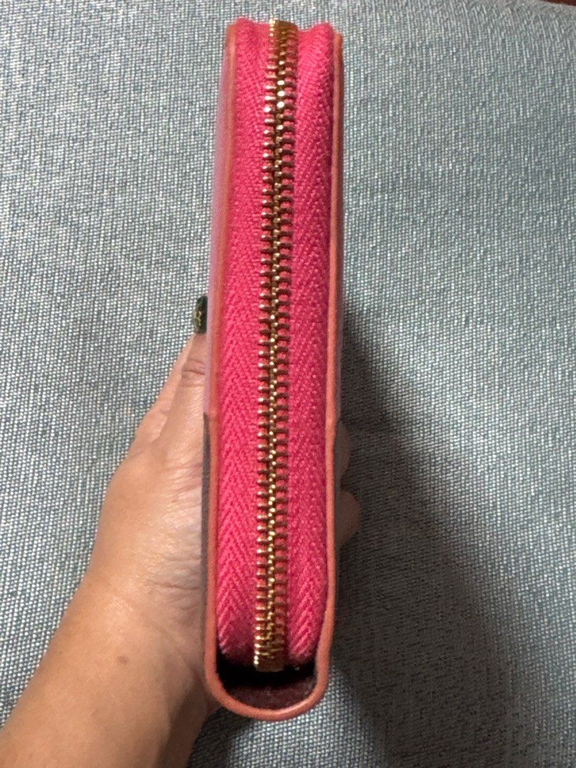 Celine Bi-Color Zip Around Wallet (Category: Luxury Bags & Wallets) located in Davao. Submitted by emeraldjecko (Listing ID 1407582939, Image 3). Description: - Authentic Celine wallet - Bi-color design: Pink and brown leather - Zip-around closure with gold-tone zipper - Interior: Multiple card slots and zippered compartment - Made in Italy.