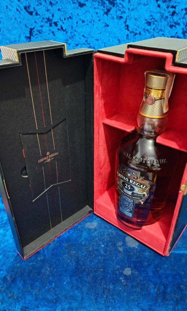 Chivas Regal 25 Blended Scotch Whisky (Category: Beverages) located in Manila. Submitted by vastturtle-53eb (Listing ID 1407631246, Image 3). Description: - Chivas Regal 25 Blended Scotch Whisky - 25 years old - Includes original box - Red-lined box with black exterior - Gold-colored accents.