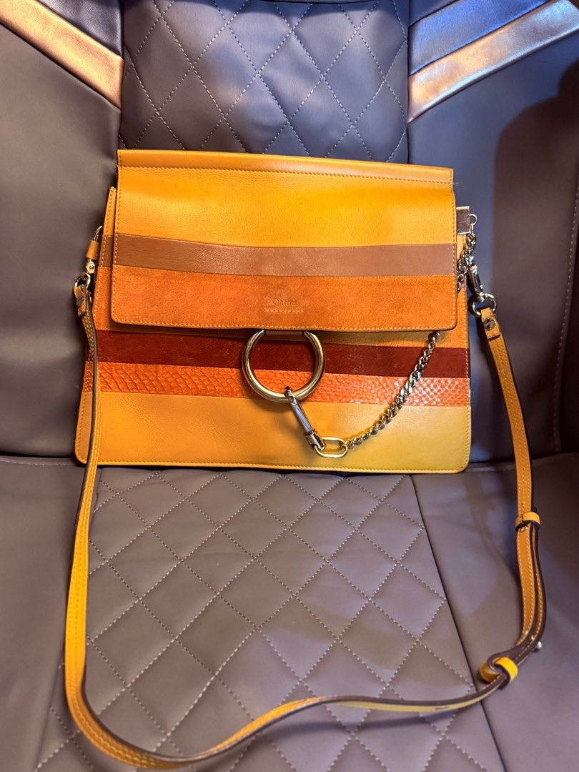 Chloe Shoulder Bag (Category: Luxury Bags & Wallets) located in Makati City. Submitted by martinoloco (Listing ID 1407717554, Image 2). Description: - Chloe shoulder bag - comes with dustbag - Vibrant color palette - Flap closure with large metal ring - Includes chain strap - Detachable shoulder strap - Multiple color blocks and textures Price negotiable - lightly used.