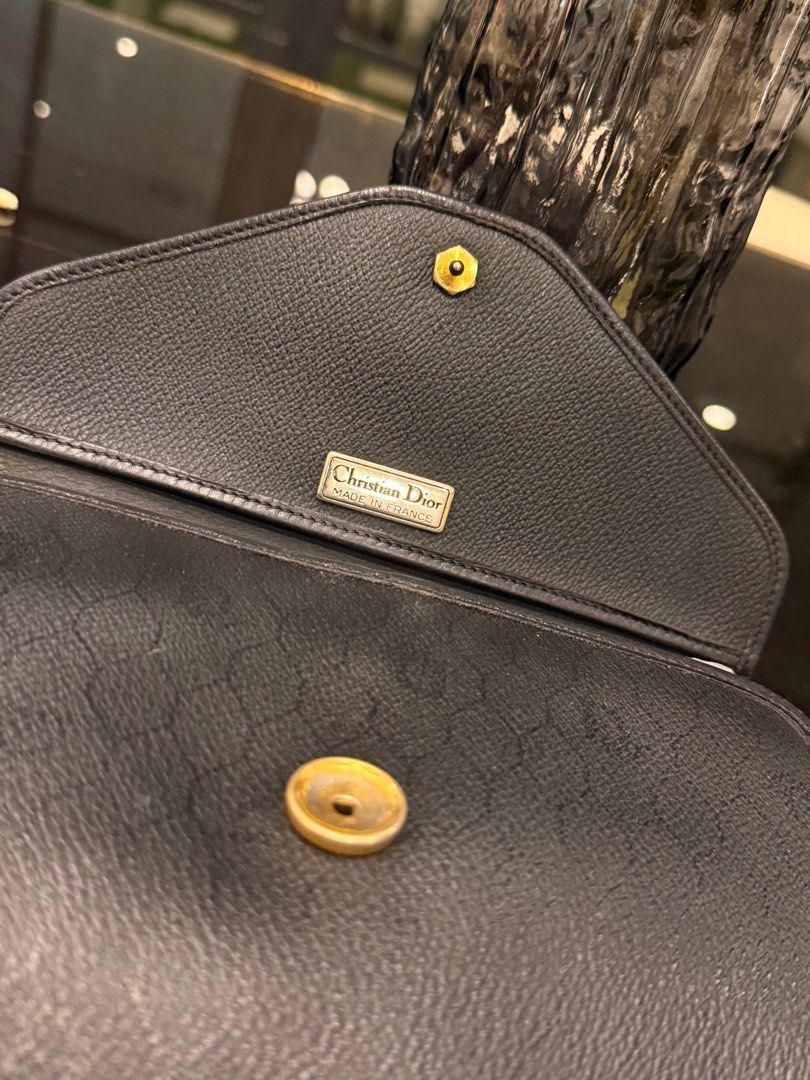 Christian Dior Black Shoulder Bag with Chain (Category: Luxury Bags & Wallets) located in Cavite. Submitted by kleaningoutmykloset (Listing ID 1407646597, Image 3). Description: - Christian Dior black shoulder bag - Gold chain strap - Flap closure with Dior emblem - Authentic Christian Dior label - Textured leather exterior - Classic and stylish design.