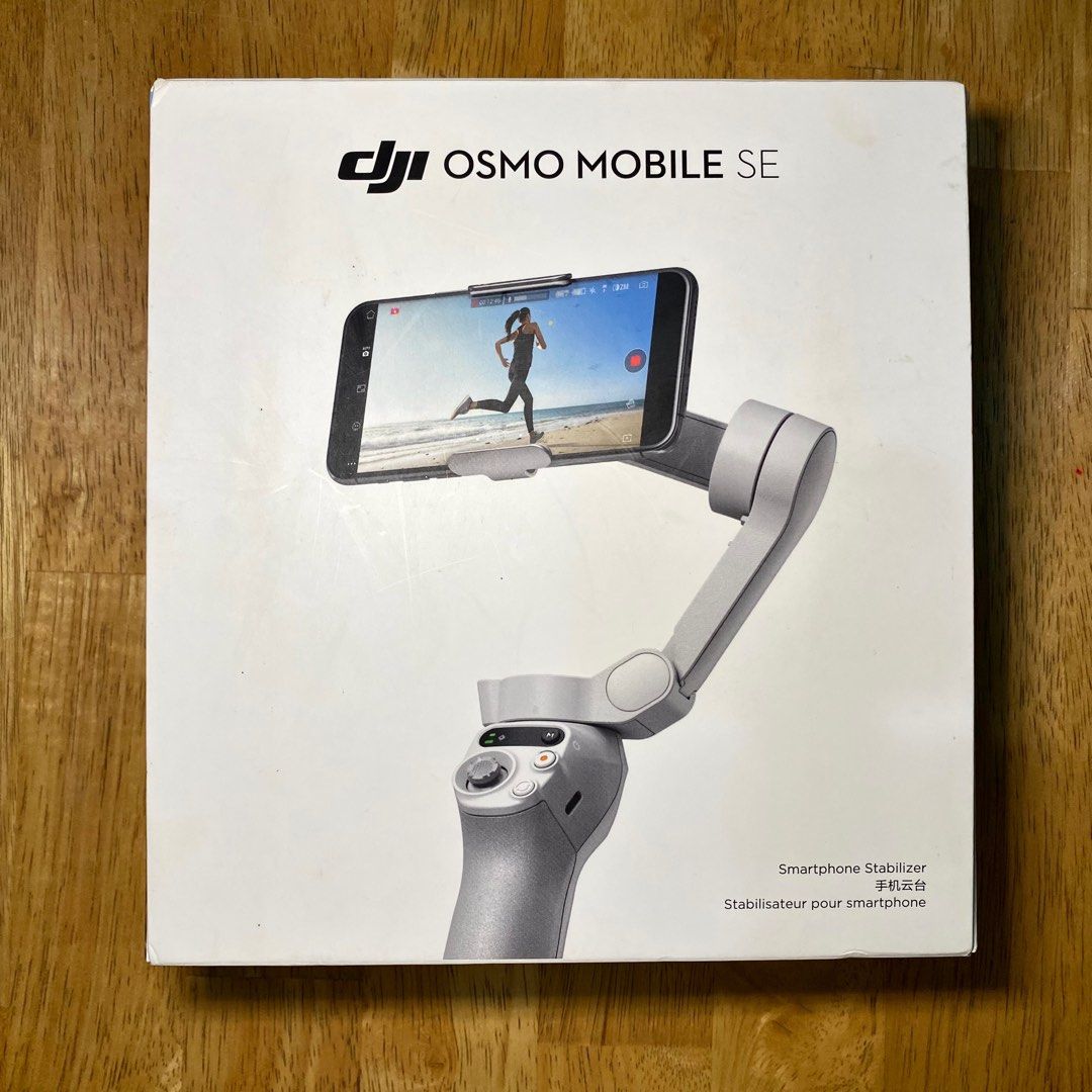 DJI Osmo Mobile SE Smartphone Stabilizer (Category: Gimbals & Stabilizers ) located in Bulacan. Submitted by puzzles_piece (Listing ID 1407673582, Image 2). Description: Not even used, just opened No issue and comes with all the inclusions Includes: Stabilizer, tripod, charging cable, phone clamp, and box.