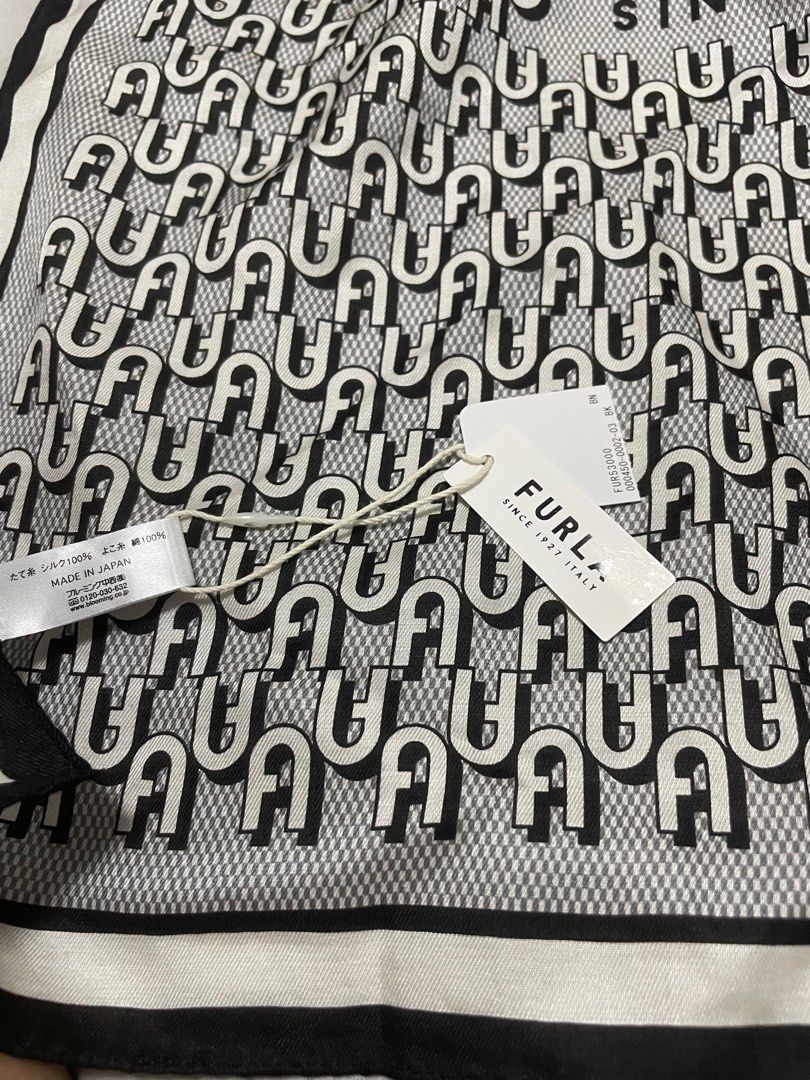 FURLA / [58 x 58 cm] Printed Handkerchief (Category: Scarves) located in Makati City. Submitted by sammy5649 (Listing ID 1407694500, Image 2). Description: - Authentic Furla silk scarf - Features Furla logo pattern - Made in Japan - Elegant black and white design - Square shape - Crafted from 100% silk - Brand New.