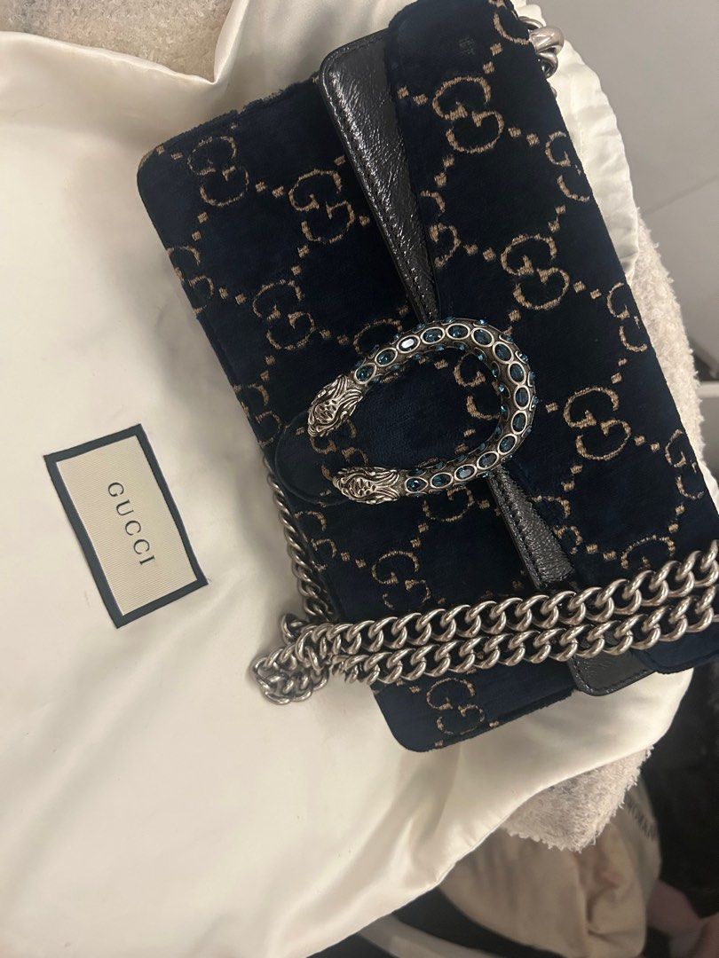 Gucci Dionysus Velvet Shoulder Bag (Category: Luxury Bags & Wallets) located in Cavite. Submitted by baglover26 (Listing ID 1407682939, Image 1). Description: - Authentic Gucci Dionysus shoulder bag - Navy velvet exterior with GG pattern - Silver-tone chain strap - Tiger head closure with blue crystal embellishments - Includes white dust bag with Gucci logo.