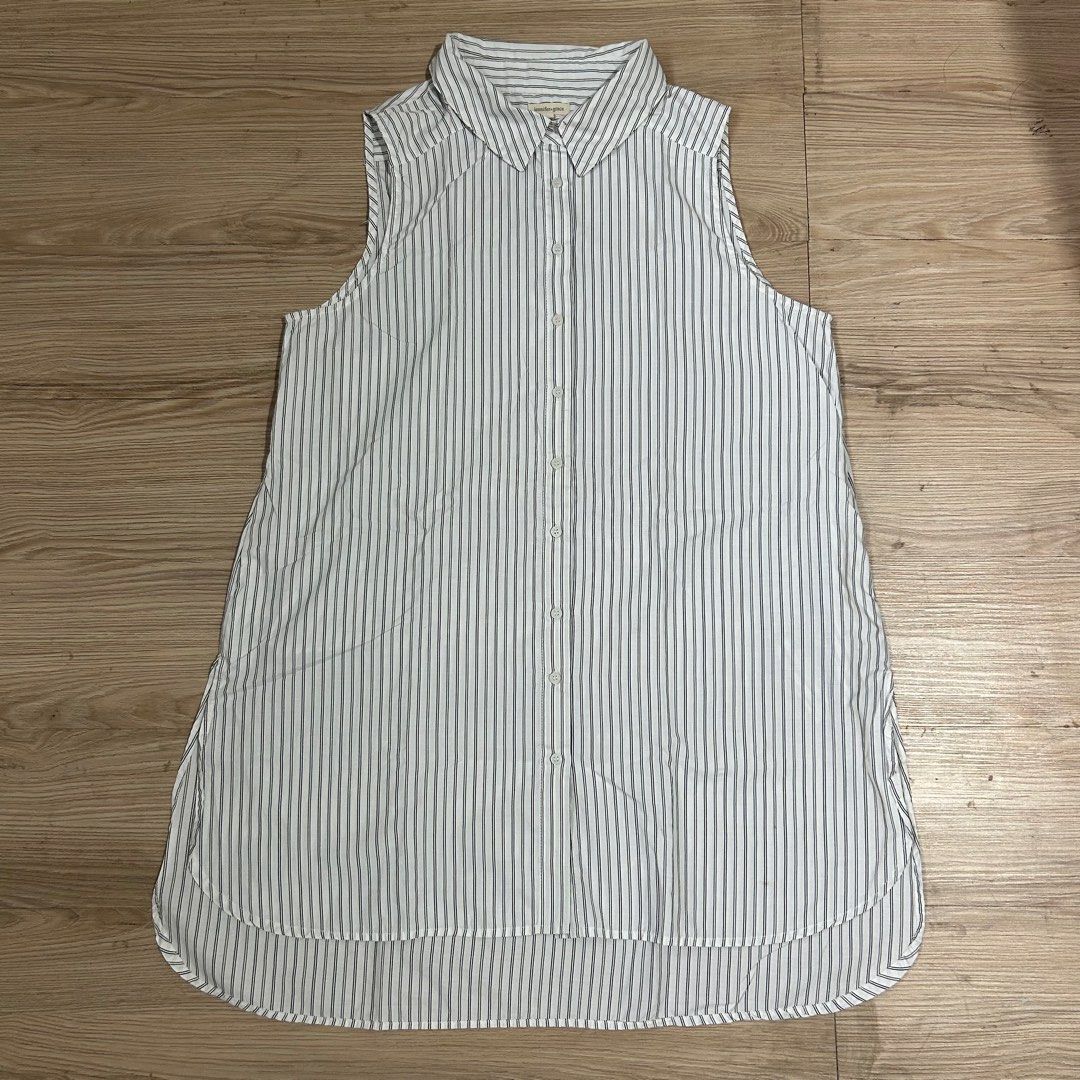 Jennifer & Grace Sleeveless Striped long Top (Category: Sleeveless) located in Manila. Submitted by angely12 (Listing ID 1407649736, Image 1). Description: - Jennifer & Grace sleeveless top - Collared neckline - Button-down front - White and gray vertical stripes - Curved hemline - Small stain near the collar - Tag visible - US bought -Fits large to semi xl.