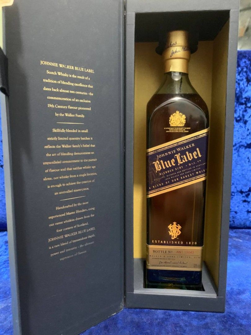 Johnnie Walker Blue Label Blended Scotch Whisky (Category: Beverages) located in Manila. Submitted by vastturtle-53eb (Listing ID 1407607396, Image 1). Description: - Johnnie Walker Blue Label Blended Scotch Whisky - Presented in a dark blue box - Features a gold-colored top - Blue label with gold lettering - Established in 1820 - Premium blended Scotch whisky.