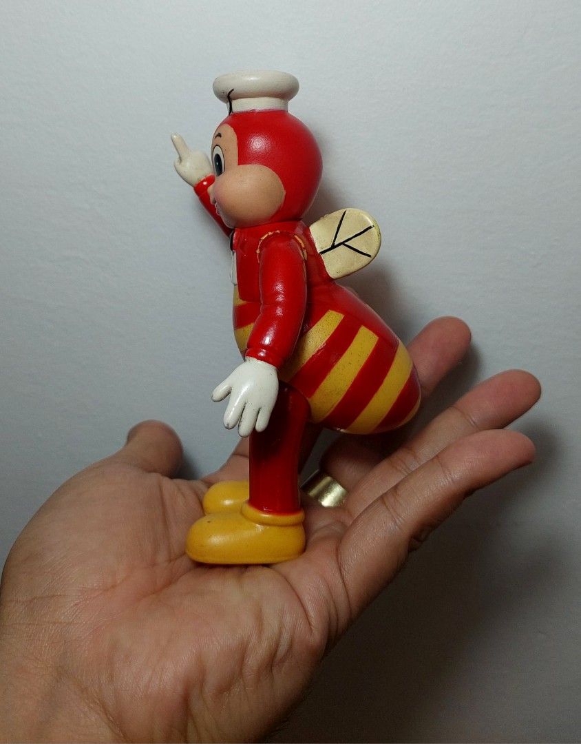 Jollibee vintage standee figure (Category: Character Goods) located in Valenzuela. Submitted by jaguar0706 (Listing ID 1407577285, Image 2). Description: Jollibee Bee figure is a collectible item. It features the iconic Jollibee character in a bee-like design, complete with wings and a chef's hat. The figure is red and yellow in color. It is a vintage item, perfect for collectors or Jollibee enthusiasts, have paint chip but still presentable for 