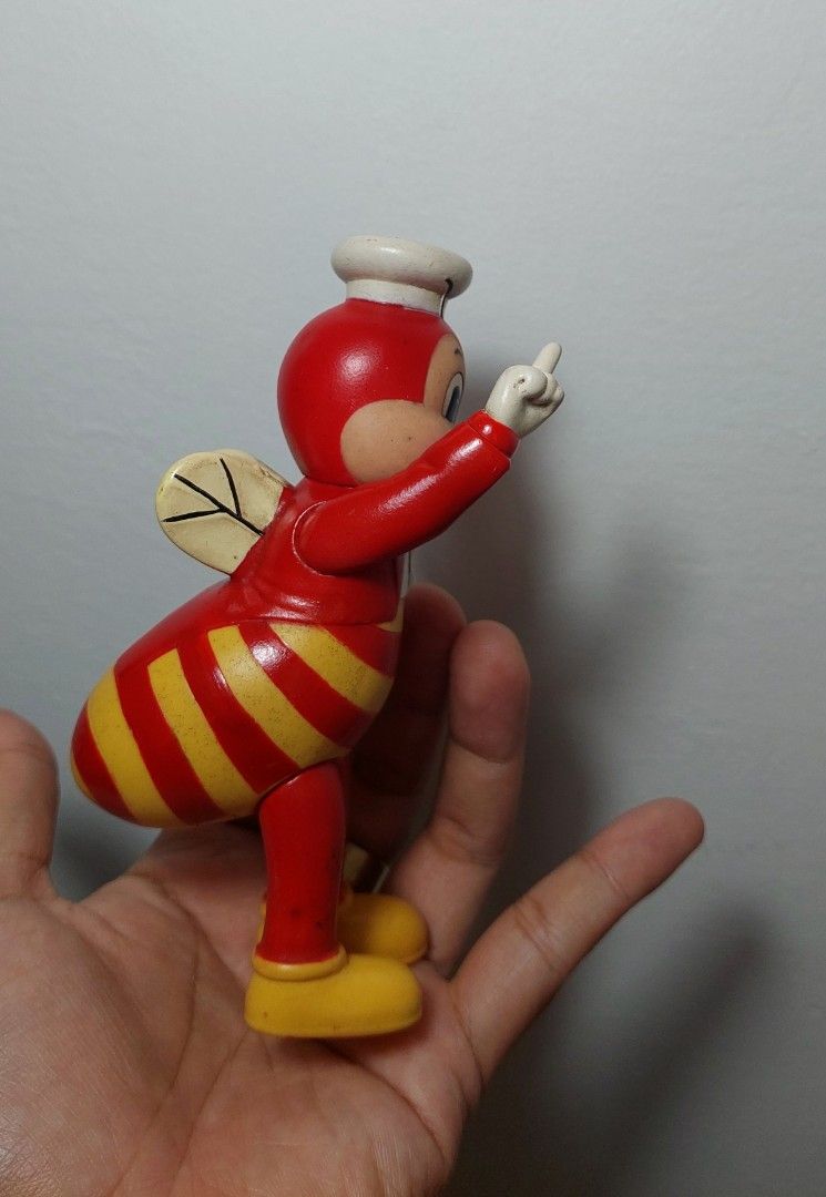 Jollibee vintage standee figure (Category: Character Goods) located in Valenzuela. Submitted by jaguar0706 (Listing ID 1407577285, Image 3). Description: Jollibee Bee figure is a collectible item. It features the iconic Jollibee character in a bee-like design, complete with wings and a chef's hat. The figure is red and yellow in color. It is a vintage item, perfect for collectors or Jollibee enthusiasts, have paint chip but still presentable for 