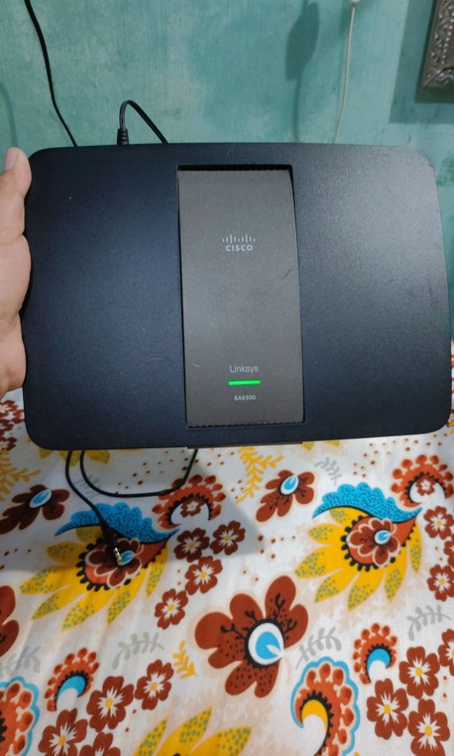 Linksys EA6300 Smart Wi-Fi Route (Category: Networking) located in Manila. Submitted by imperialfeline (Listing ID 1407724872, Image 2). Description: It is a dual-band router operating on 2.4 GHz and 5 GHz frequencies simultaneously. It features four Gigabit Ethernet ports for wired devices and a USB 3.0 port for sharing content and printers across the network. The router uses AC1200 Wi-Fi technology and supports IPv6 for future-proofing your net