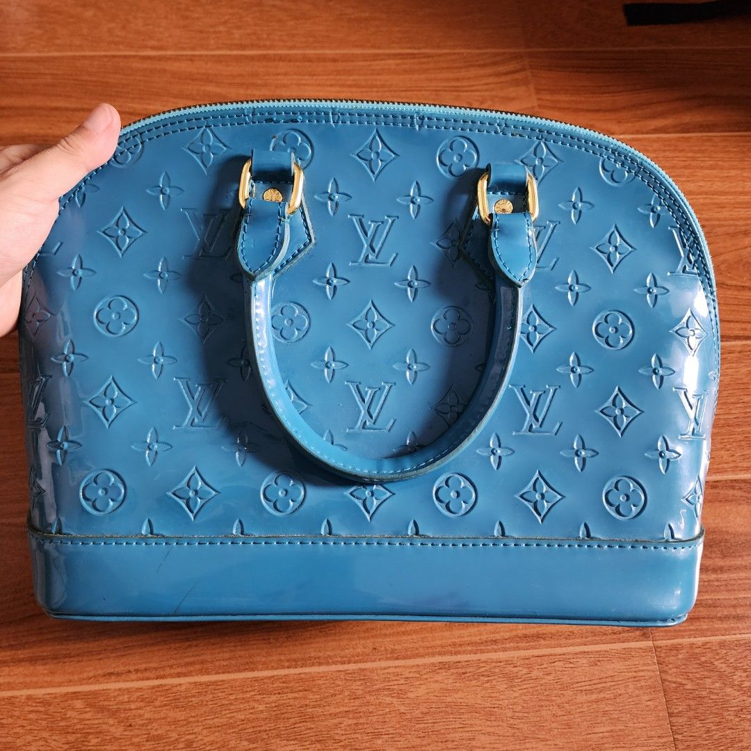 Louis Vuitton Alma BB Handbag and Wallet Set (Category: Luxury Bags & Wallets) located in Meycauayan. Submitted by MP_Shop (Listing ID 1407705032, Image 2). Description: - Louis Vuitton Alma BB handbag and wallet set. - Handbag: Glossy blue exterior with LV monogram, darker blue interior. - Wallet: Green with LV monogram. Size: 6W x 15L x 8H inches Excellent Condition Color rate: 10/10 Loc: Meycauayan Bulacan Courier: J&T Mop: Gcash .