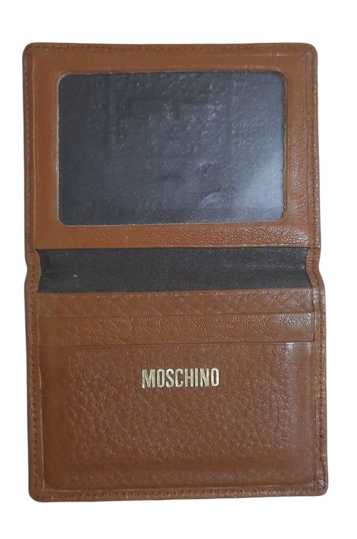 Moschino Leather Card Holder (Category: Luxury Bags & Wallets) located in Makati City. Submitted by fiestypam (Listing ID 1407735659, Image 3). Description: Pre-owned. No damage, no smell, just signs of usage. Can fit 3 atm cards with a separate pocket for photos. Leather is soft and light. DF c/o buyer. .