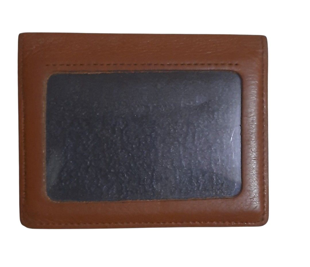 Moschino Leather Card Holder (Category: Luxury Bags & Wallets) located in Makati City. Submitted by fiestypam (Listing ID 1407735659, Image 2). Description: Pre-owned. No damage, no smell, just signs of usage. Can fit 3 atm cards with a separate pocket for photos. Leather is soft and light. DF c/o buyer. .