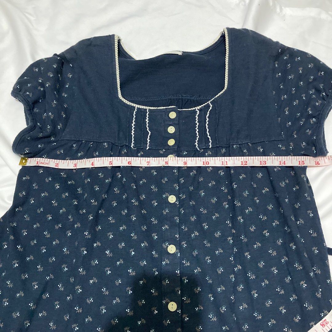 Navy Blue Button Down Dress Shoujo Mori kei (Category: Blouses) located in Angeles City. Submitted by calicobluu (Listing ID 1407672217, Image 2). Description: - Navy blue dress - Features a white floral pattern - Square neckline - Short sleeves - Button-down front - Includes a waist tie - White trim around the neckline - Made of soft, comfortable fabric.