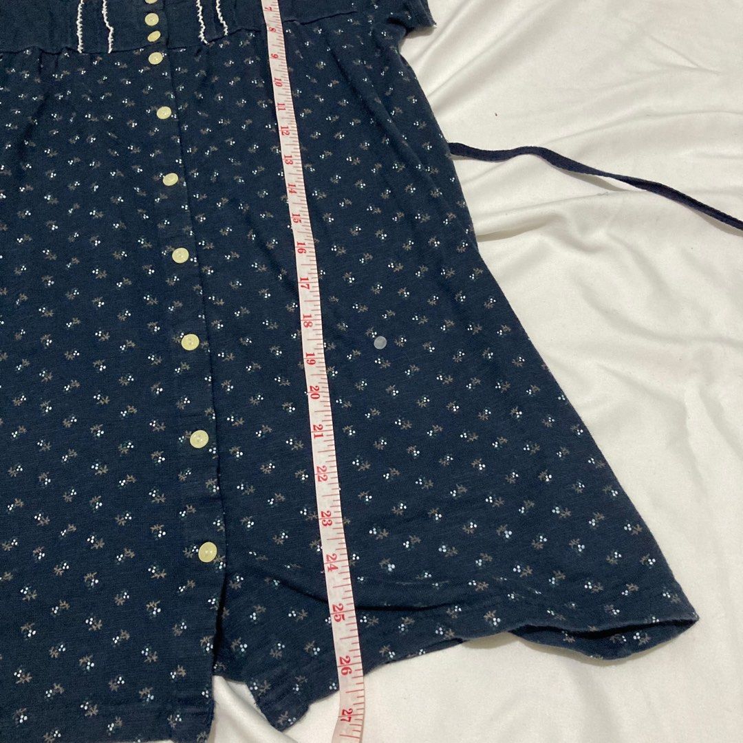 Navy Blue Button Down Dress Shoujo Mori kei (Category: Blouses) located in Angeles City. Submitted by calicobluu (Listing ID 1407672217, Image 3). Description: - Navy blue dress - Features a white floral pattern - Square neckline - Short sleeves - Button-down front - Includes a waist tie - White trim around the neckline - Made of soft, comfortable fabric.