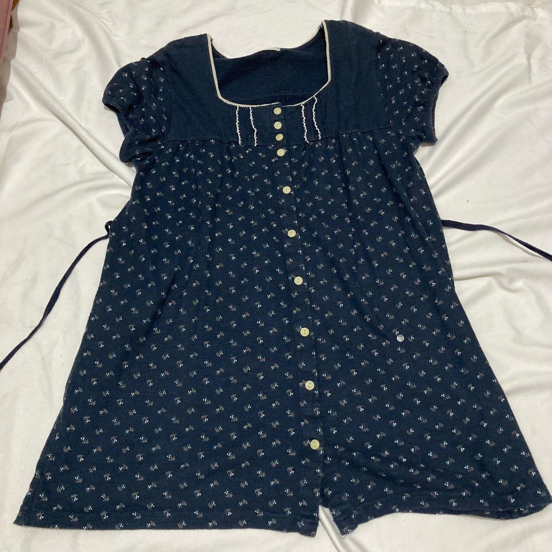 Navy Blue Button Down Dress Shoujo Mori kei (Category: Blouses) located in Angeles City. Submitted by calicobluu (Listing ID 1407672217, Image 1). Description: - Navy blue dress - Features a white floral pattern - Square neckline - Short sleeves - Button-down front - Includes a waist tie - White trim around the neckline - Made of soft, comfortable fabric.
