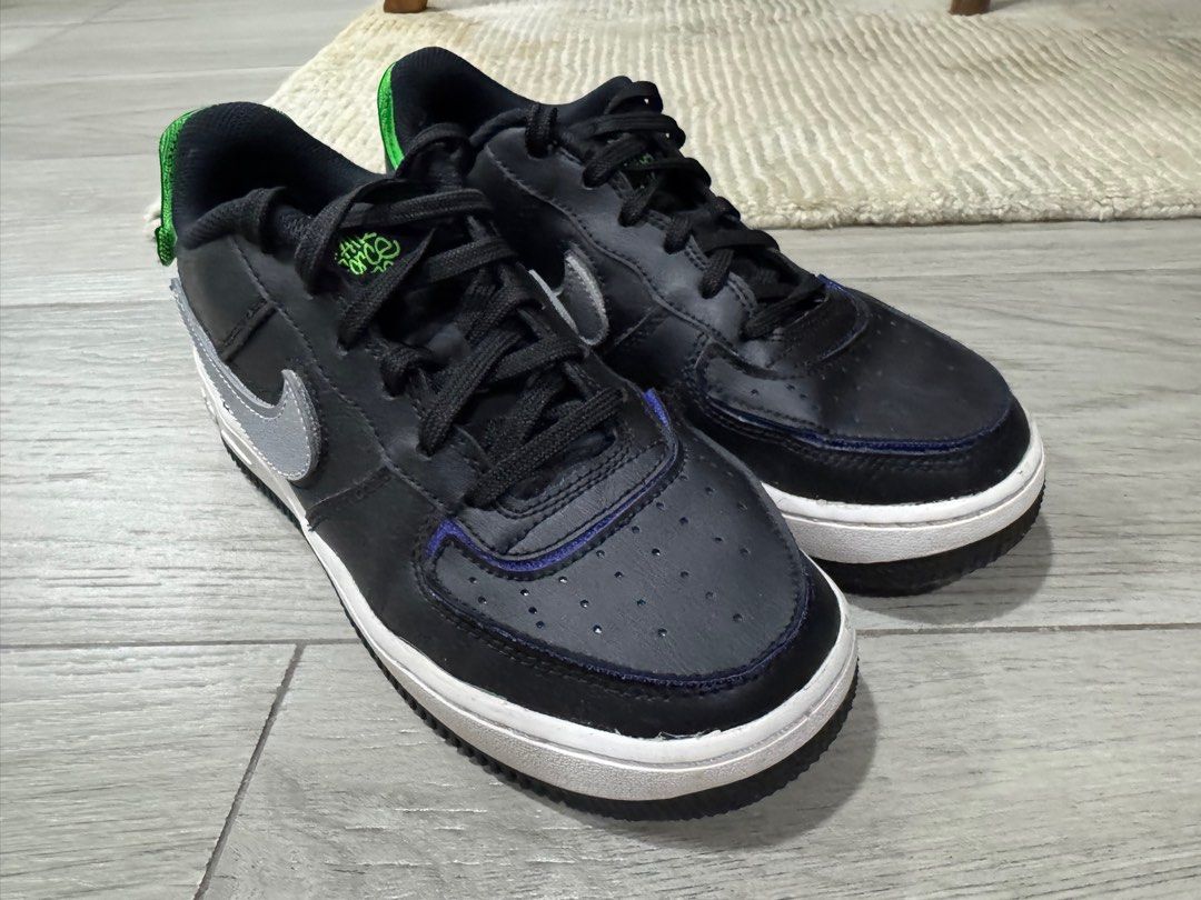 Nike Air Force 1 Black Sneakers (Category: Sneakers) located in Pasig City. Submitted by funnelboy (Listing ID 1407740597, Image 2). Description: - Nike Air Force 1 Black Sneakers - Size: EU 38 - Condition: Excellent - Features the iconic Nike design - Silver swoosh detail - Accented with pops of color on the heel and collar - Stylish and comfortable - Original‼️.