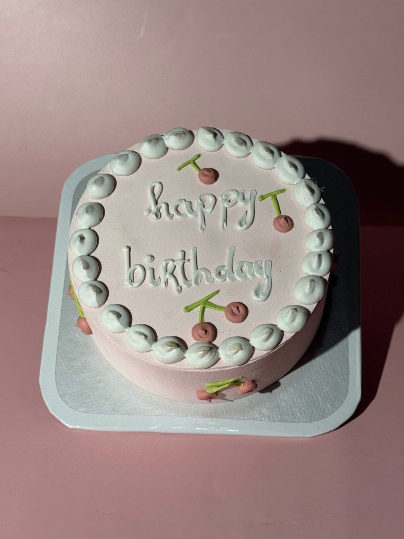 Pink Birthday Cake with Cherries (Props only) (Category: Babies & Kids Fashion) located in Calamba. Submitted by pauvely (Listing ID 1407670994, Image 1). Description: Pink birthday cake with white frosting, "Happy Birthday" message, and cherry decorations. Presented on a white cake board. Can be used as a prop. .