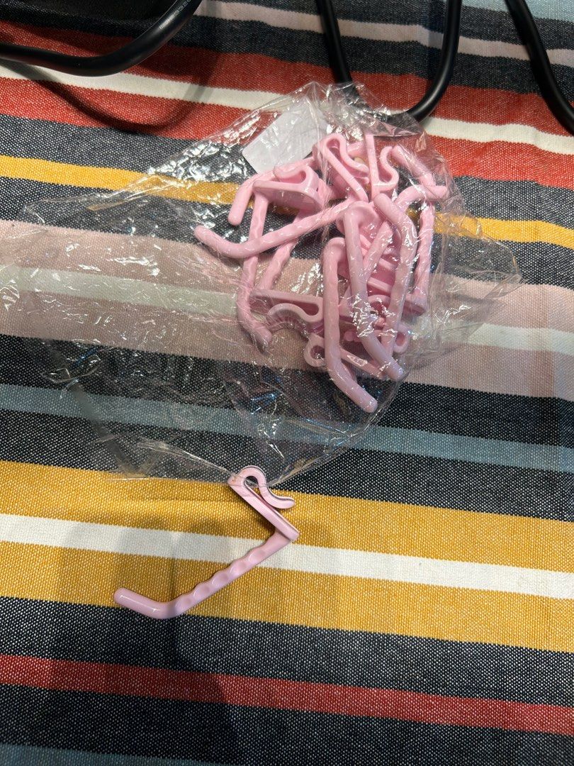Pink Clothes, product, plastic shelf Hangers Hooks (Category: Hooks & Hangers) located in Taguig. Submitted by lyeche3 (Listing ID 1407682588, Image 1). Description: Light pink hooks I have 10 pcs. 12 pesos each piece, 120 pesos for all .