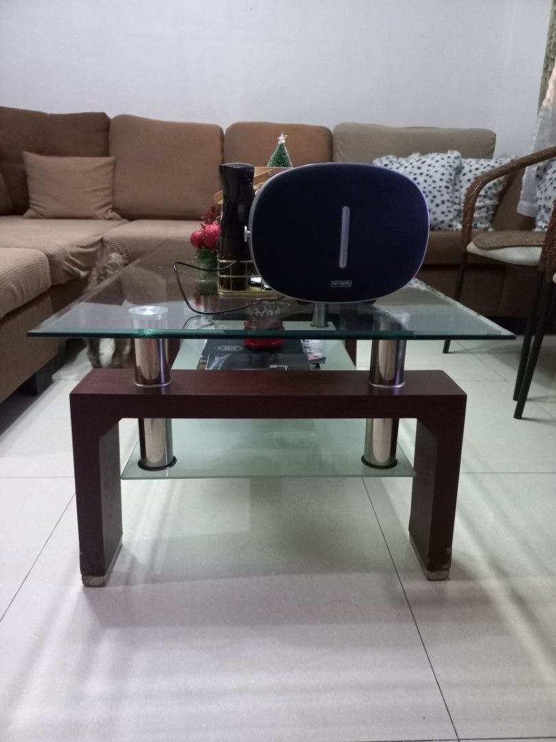 Rectangular center table (Category: Other Home Furniture) located in Manila. Submitted by joanparungao012022 (Listing ID 1407602641, Image 2). Description: want to change my center table to a smaller one... tempered glass,solid wood,stainless no chips very minimal glass scratch small scratch on some part of the wood..