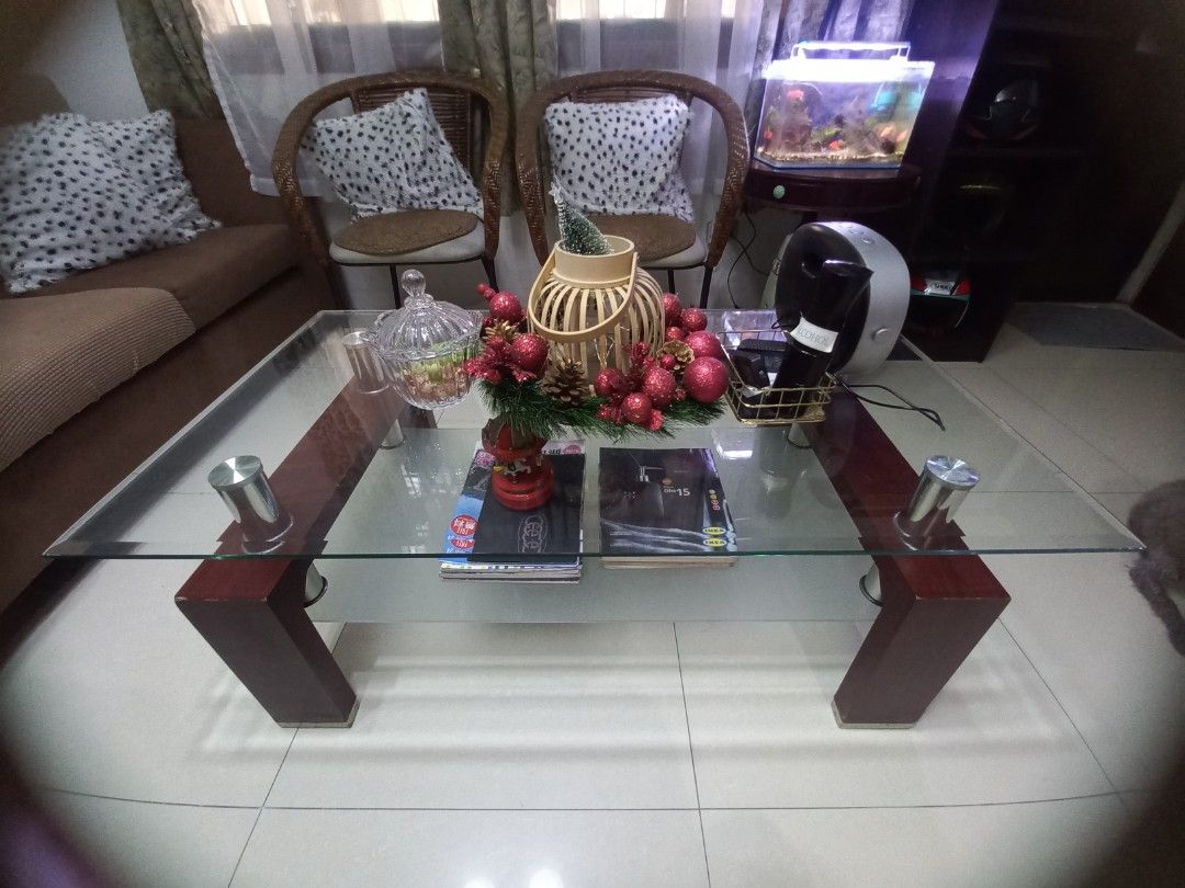 Rectangular center table (Category: Other Home Furniture) located in Manila. Submitted by joanparungao012022 (Listing ID 1407602641, Image 3). Description: want to change my center table to a smaller one... tempered glass,solid wood,stainless no chips very minimal glass scratch small scratch on some part of the wood..
