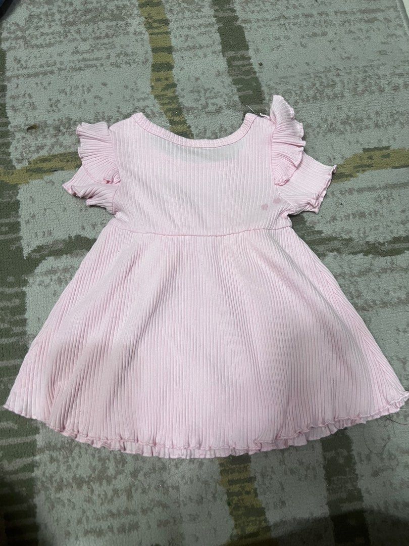 SHEIN Pink Ruffle Dress 1-3M (Category: Dresses) located in Manila. Submitted by pretty_perrydecluttery (Listing ID 1407667803, Image 2). Description: - Pink SHEIN baby dress - Designed for 1-3 month olds - Features ribbed texture - Ruffled sleeves and neckline - Cute bow detail - Flared skirt - Comfortable fit - Ideal for special occasions or everyday wear.