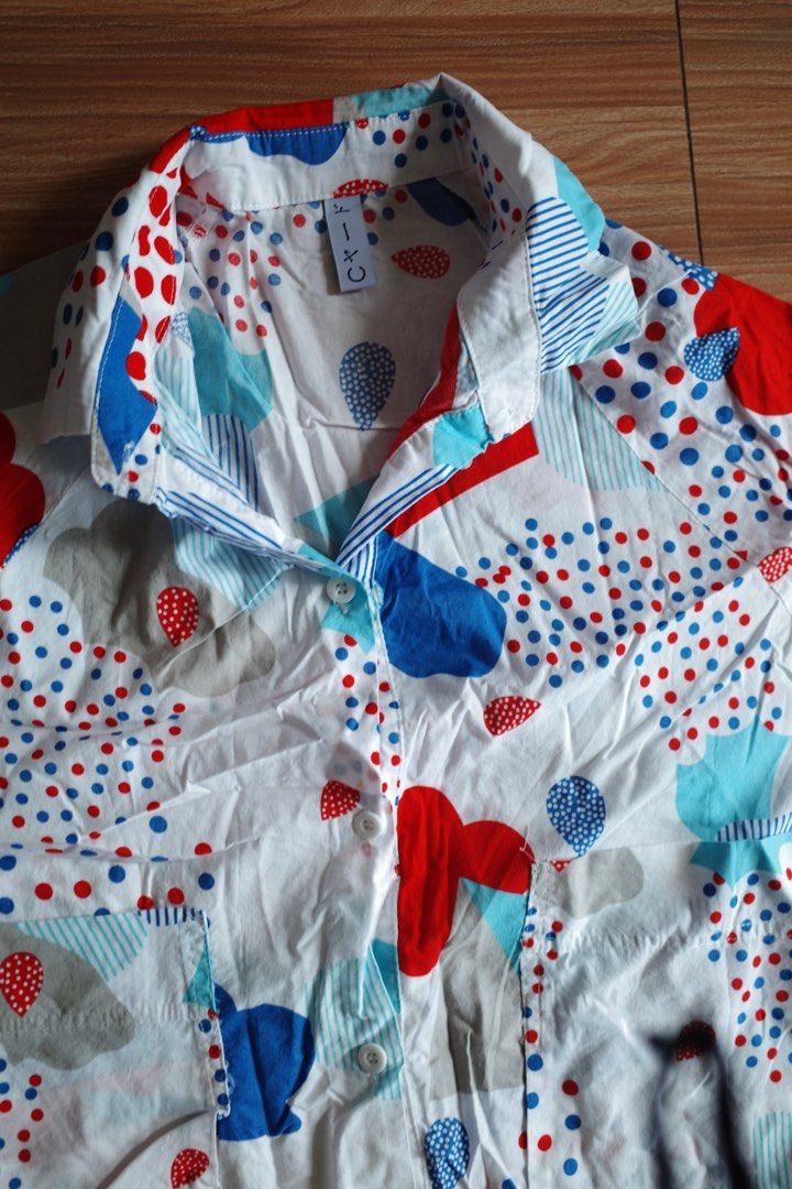 Vintage Printed Dress (Category: Dresses) located in Makati City. Submitted by bluelocker (Listing ID 1407653219, Image 2). Description: - Vintage shirt - Unique red, blue, and white print - Short sleeves - Collared neckline - Button-down front - Lightweight fabric - Relaxed fit - Chest pocket - Perfect for warm weather.