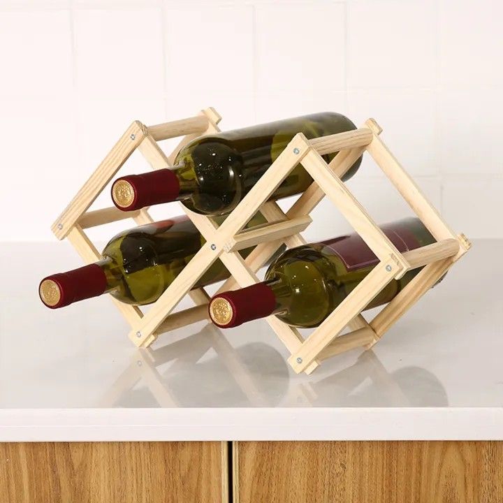 Wooden Wine rack (Category: Wine Cellar & Storage) located in Quezon City. Submitted by an.marie (Listing ID 1407633929, Image 3). Description: Check out this stylish wooden wine rack! Perfect for displaying your favorite bottles. It's a simple yet elegant design that will look great in any home. The natural wood finish adds a touch of warmth. 📍 Loc: Sauyo, QC Can do same day delivery or any of your prefer courier AVAILABLE AS LONG AS POSTED 🫰.