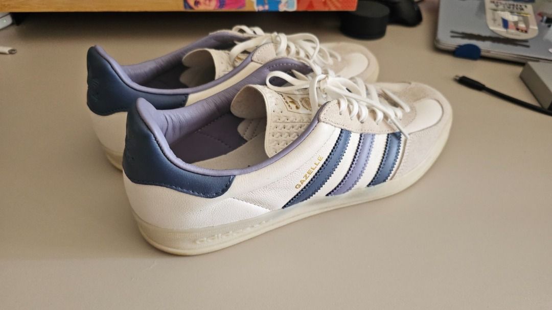 Adidas Gazelle Indoor (Category: Sneakers) located in Pasig City. Submitted by __sell__ (Listing ID 1412533312, Image 3). Description: Authentic Adidas Gazelle Indoor sneakers in white with blue accents. Bought from Commonwealth Greenbelt (legit retail). Size: US 10 Condition: Used, good condition (normal light creasing from wear) Soles: Clean, no sole separation Box: No.