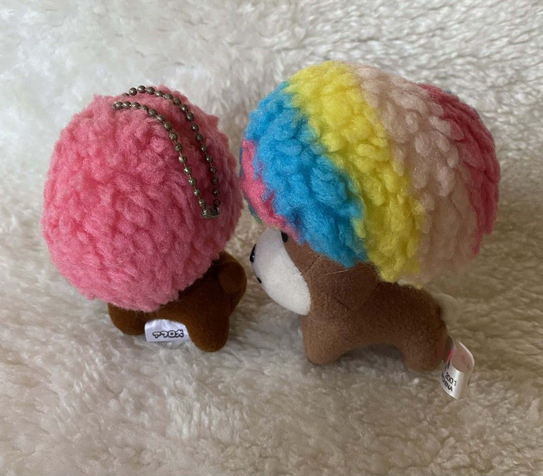 Afro ken (Category: Plushies & Soft Toys) located in Gasan. Submitted by averydemi1922 (Listing ID 1412647966, Image 2). Description: - Adorable plush dog keychains - Available with pink or colorful hair - Features a cute face and brown body - Pink-haired dog includes a chain - Great for collectors or as a cute accessory 500 each set 750.