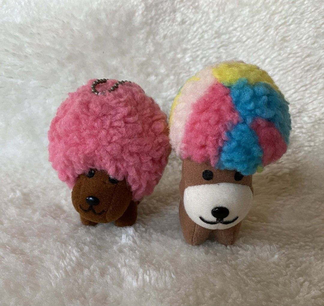 Afro ken (Category: Plushies & Soft Toys) located in Gasan. Submitted by averydemi1922 (Listing ID 1412647966, Image 1). Description: - Adorable plush dog keychains - Available with pink or colorful hair - Features a cute face and brown body - Pink-haired dog includes a chain - Great for collectors or as a cute accessory 500 each set 750.