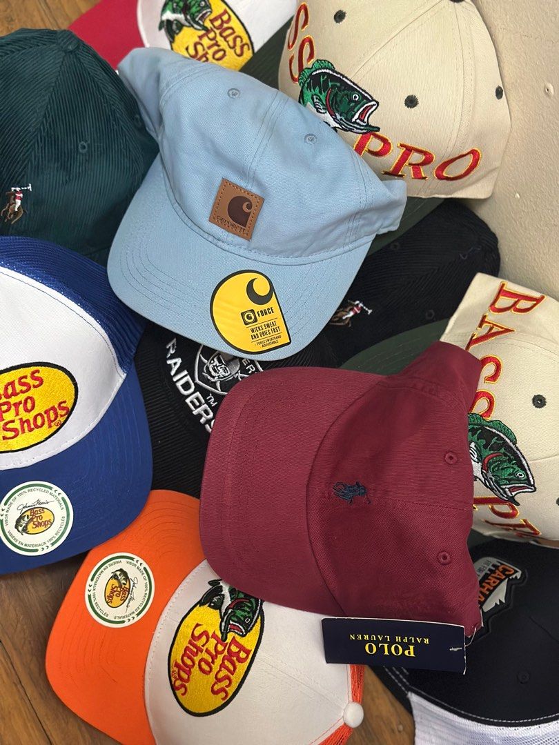Assorted Caps: Bass Pro Shops, Carhartt, Polo (Category: Caps & Hats) located in Mandaluyong City. Submitted by hype90s (Listing ID 1412573323, Image 2). Description: This items are not for free, please visit our profile for more details 🫰🏻 Collection of caps from various brands. Includes Bass Pro Shops trucker caps in blue, orange, and white. There's a Carhartt cap in light blue and a black Raiders cap. Also features Polo Ralph Lauren caps in 