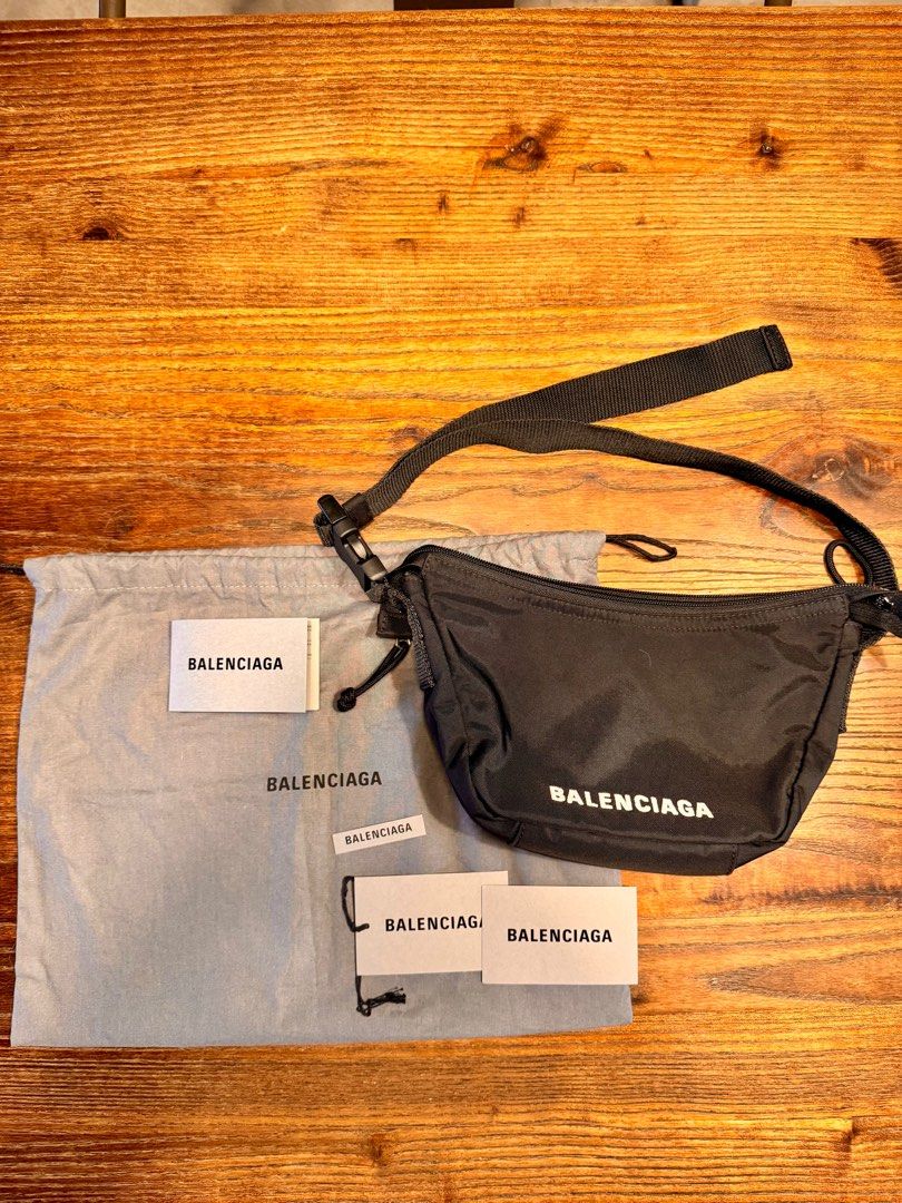Balenciaga Wheel Sling Bag (Category: Luxury Bags & Wallets) located in Taguig. Submitted by pritsu (Listing ID 1412548564, Image 1). Description: Decluttering personal items. Bought in Amsterdam. PM for more photos. - Balenciaga wheel Bag - Color: Black - Features: - Main compartment with zipper closure - Adjustable strap - Includes: Dust bag and tags - Design: Balenciaga logo printed on the front - Perfect for everyday use. Kili kili bag 😊.