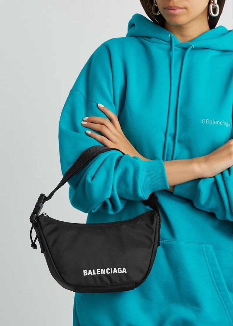 Balenciaga Wheel Sling Bag (Category: Luxury Bags & Wallets) located in Taguig. Submitted by pritsu (Listing ID 1412548564, Image 2). Description: Decluttering personal items. Bought in Amsterdam. PM for more photos. - Balenciaga wheel Bag - Color: Black - Features: - Main compartment with zipper closure - Adjustable strap - Includes: Dust bag and tags - Design: Balenciaga logo printed on the front - Perfect for everyday use. Kili kili bag 😊.