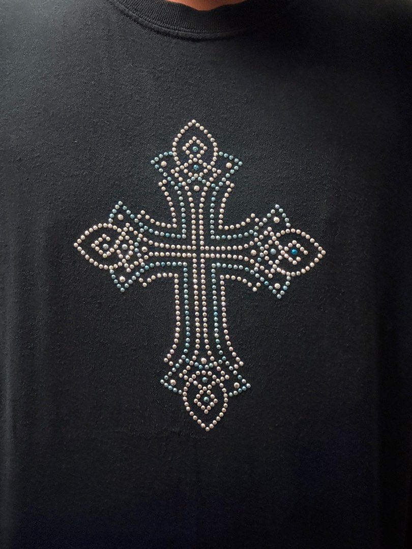 Black Cross Rhinestone T-shirt (Category: Tshirts & Polo Shirts ) located in Mandaluyong City. Submitted by thetinycloset_ (Listing ID 1412694499, Image 2). Description: - Black t-shirt - Rhinestone cross design on front - Embellished with various rhinestone sizes - Short sleeves - Crew neck - Standard cotton blend fabric - Dark color (black or very dark navy).