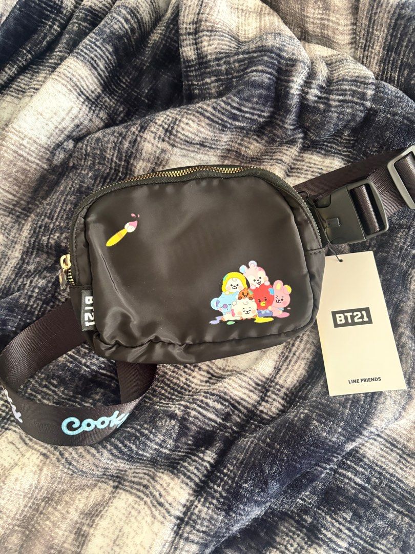 BTS BT21 Line Friends Bag from NY (Category: Cross-body Bags) located in Manila. Submitted by _heya (Listing ID 1412685773, Image 3). Description: Very cute BT21 bag from Line Store NYC 💜 - Black waist bag with BT21 characters on the front. - Zippered main compartment and an adjustable strap with the BT21 characters' names. - With a buckle closure for secure wear..