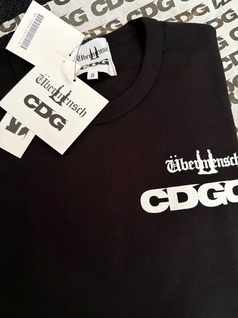 CDG: G-DRAGON Übermensch Printed T-Shirt (Black) | DSML E-SHOP S