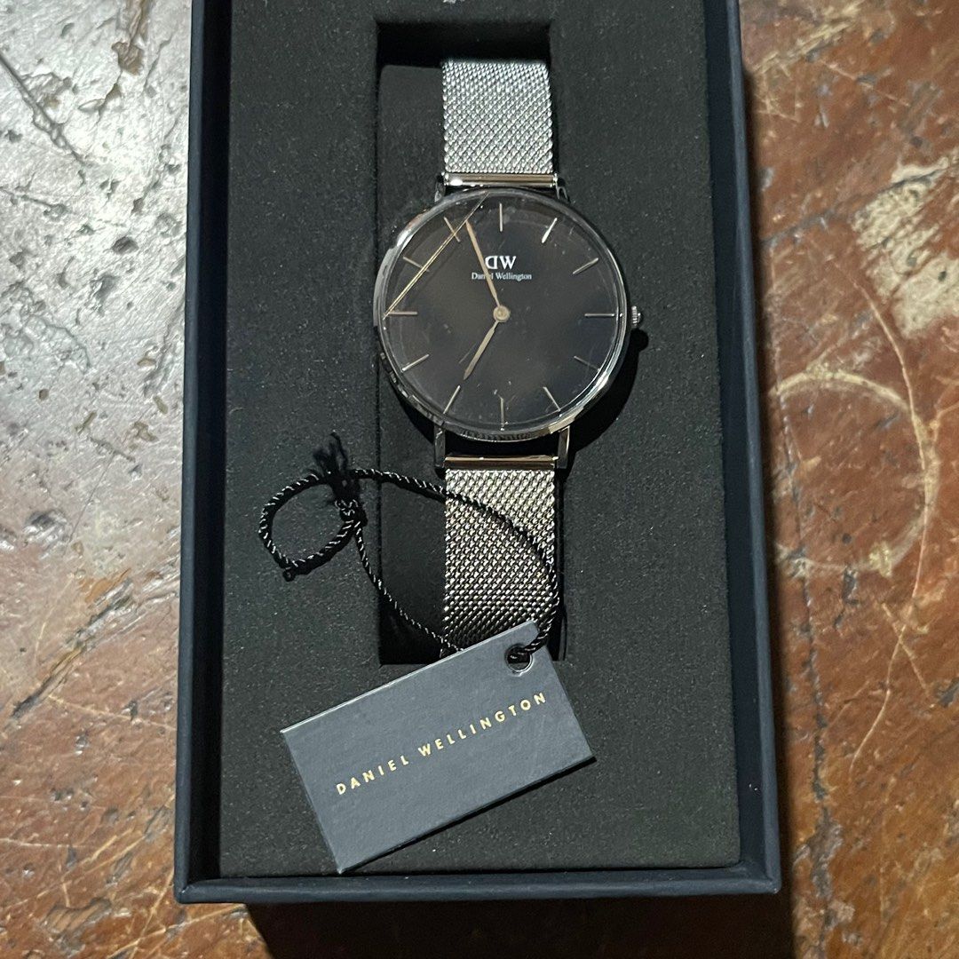 Daniel Wellington Petite Sterling Watch (Category: Women's Watches) located in Caloocan City. Submitted by earthissoft (Listing ID 1412683979, Image 3). Description: Daniel Wellington Petite Sterling Watch • Model / Art No.: DW00100162 • Size: 32mm • Material: Stainless Steel • Condition: Never used (display kept) • Battery: Needs replacement • SRP: ₱9,900 • Selling Price: ₱4,000 Reason for Selling: Never used, letting it go. Meetup / Delivery: A
