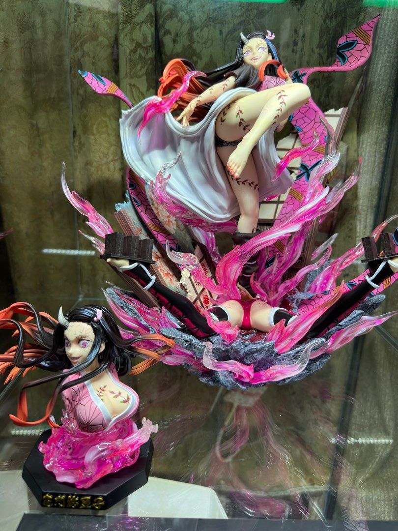 Demon Slayer Nezuko Statue (Category: Figurines & Statues) located in Quezon City. Submitted by tkmarl (Listing ID 1412706669, Image 2). Description: - Nezuko Kamado statue from Demon Slayer. - Dynamic pose with vibrant pink and purple effects. - Comes with multiple parts and accessories. - Collector's item. - Perfect for Demon Slayer fans..