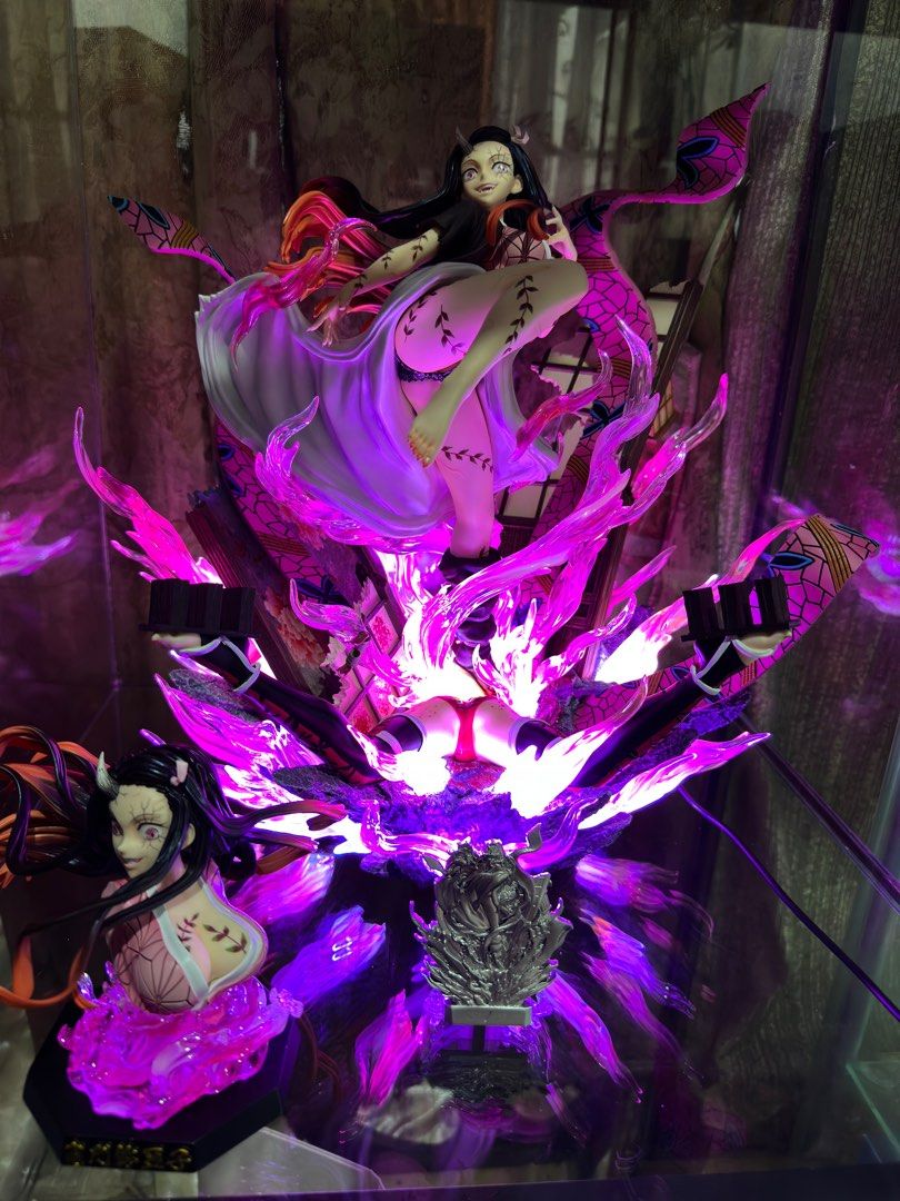 Demon Slayer Nezuko Statue (Category: Figurines & Statues) located in Quezon City. Submitted by tkmarl (Listing ID 1412706669, Image 1). Description: - Nezuko Kamado statue from Demon Slayer. - Dynamic pose with vibrant pink and purple effects. - Comes with multiple parts and accessories. - Collector's item. - Perfect for Demon Slayer fans..