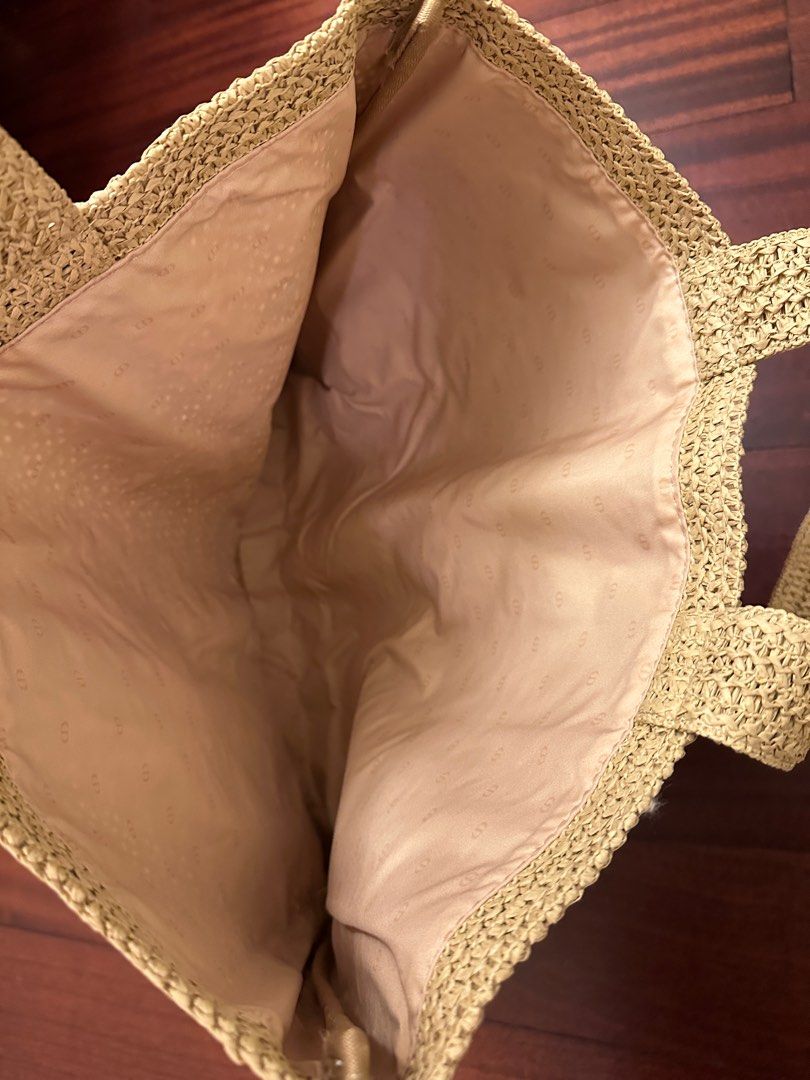 Dior Beauty Raffia Tote Bag (Category: Luxury Bags & Wallets) located in Makati City. Submitted by juju_08 (Listing ID 1412637335, Image 3). Description: - Dior tote bag - Woven design with embroidered Dior logo - Two top handles - Spacious interior - Neutral color for versatile styling - Light beige interior lining.