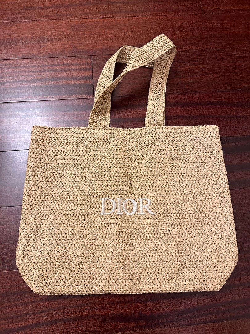 Dior Beauty Raffia Tote Bag (Category: Luxury Bags & Wallets) located in Makati City. Submitted by juju_08 (Listing ID 1412637335, Image 1). Description: - Dior tote bag - Woven design with embroidered Dior logo - Two top handles - Spacious interior - Neutral color for versatile styling - Light beige interior lining.