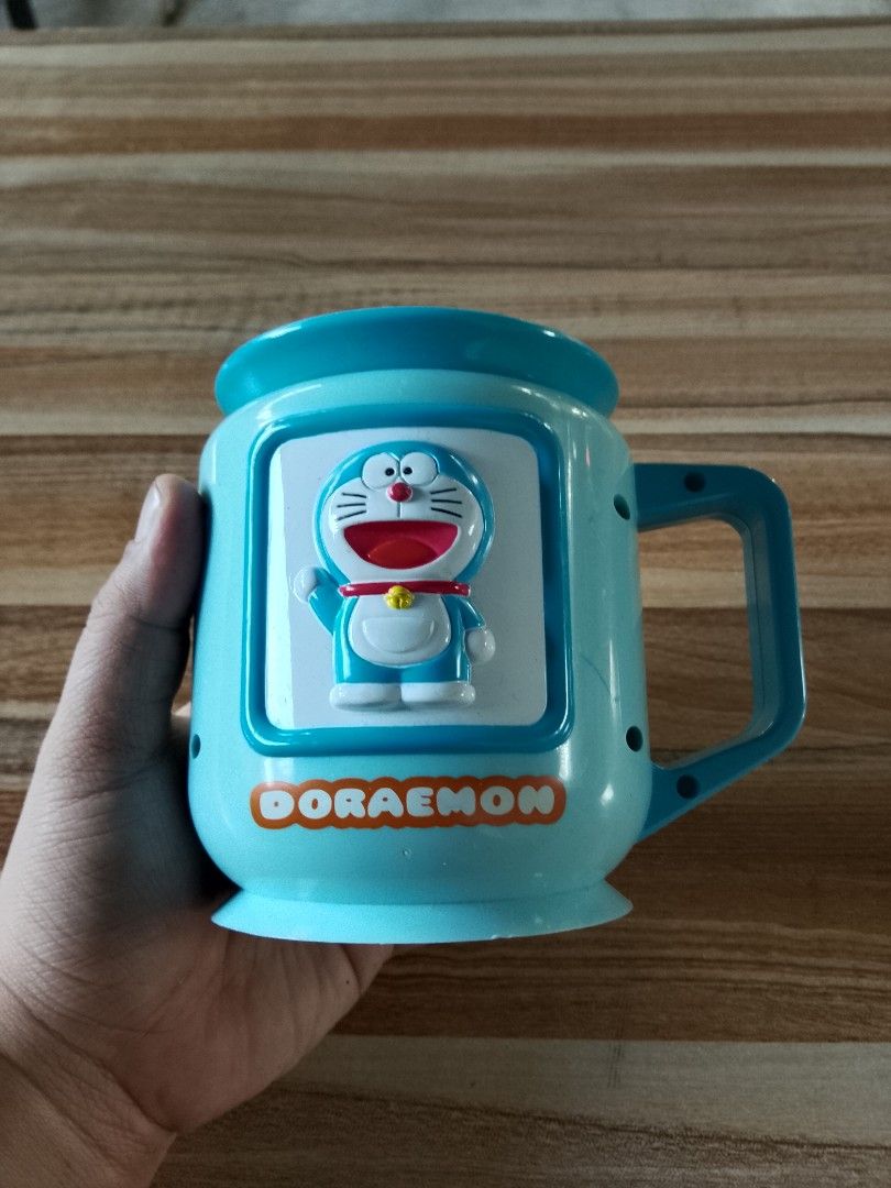 Doraemon Mugs (Category: Coffee & Tea Tableware) located in Davao. Submitted by Ysang40 (Listing ID 1412698811, Image 1). Description: 150 each, as is ito, ang isa walang takip sa bottom, same price.