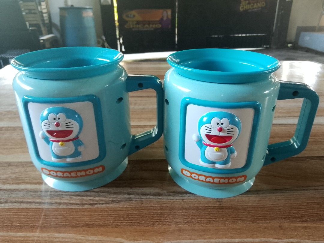 Doraemon Mugs (Category: Coffee & Tea Tableware) located in Davao. Submitted by Ysang40 (Listing ID 1412698811, Image 3). Description: 150 each, as is ito, ang isa walang takip sa bottom, same price.