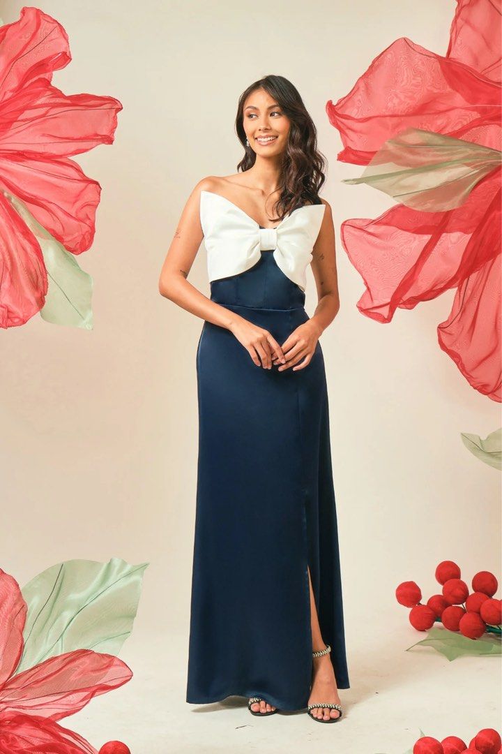 Elegant Bow-Front Maxi Dress (Category: Dresses) located in Legazpi City. Submitted by shopwithstyleeee (Listing ID 1412538450, Image 2). Description: - Strapless maxi dress - Features a bow-front bodice - Fitted silhouette - Floor-length dress - Ideal for formal events and special occasions.