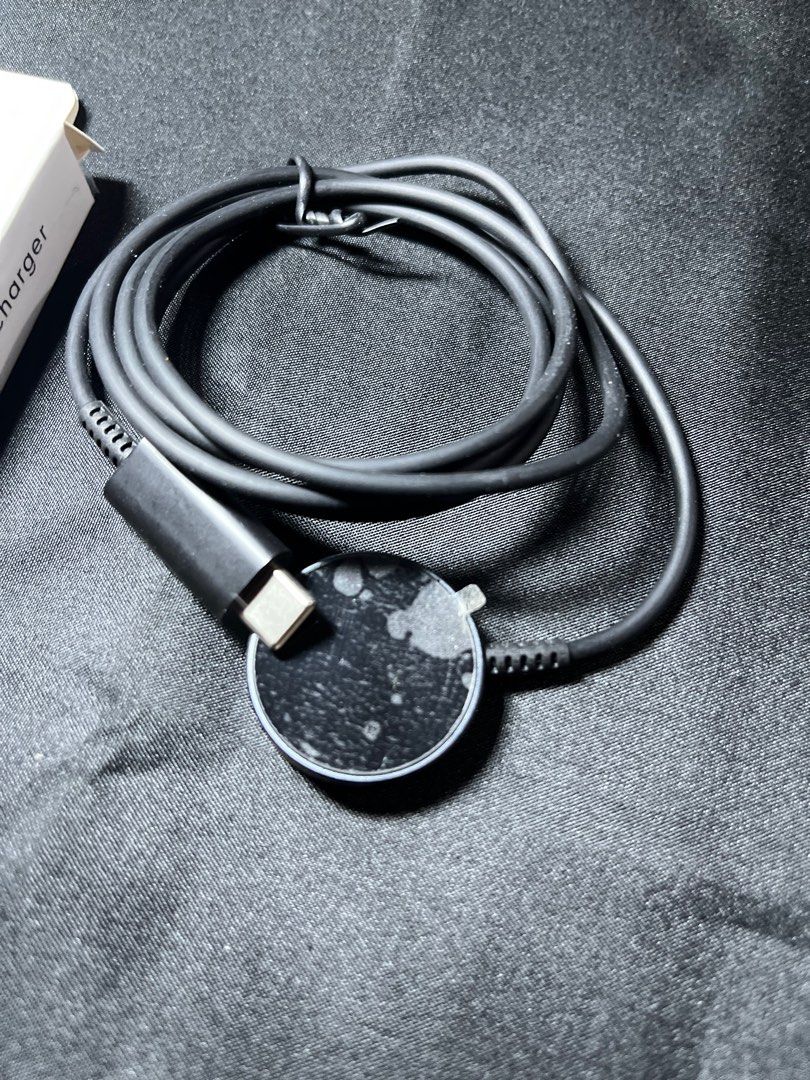 Fast Wireless Charger for Galaxy Watch (Category: Chargers & Cables) located in Manila. Submitted by nhh_accessories (Listing ID 1412691037, Image 3). Description: - Fast wireless charger for Galaxy Watch - Includes charging cable - Compatible with Galaxy Watch - Comes with the original box - Black color and round charging pad.