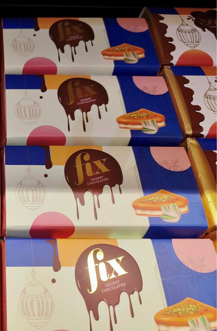 Fix Dessert Chocolatier Pistachio Chocolate Bar (Category: Other Food & Drinks) located in Manila. Submitted by mayeli (Listing ID 1412694852, Image 2). Description: Indulge in a delicious Fix Dessert Chocolatier chocolate bar. This bar features a rich chocolate exterior with a pistachio filling. The packaging showcases the brand's logo and a picture of the chocolate bar. Several bars are available, perfect for gifting or personal enjoyment..