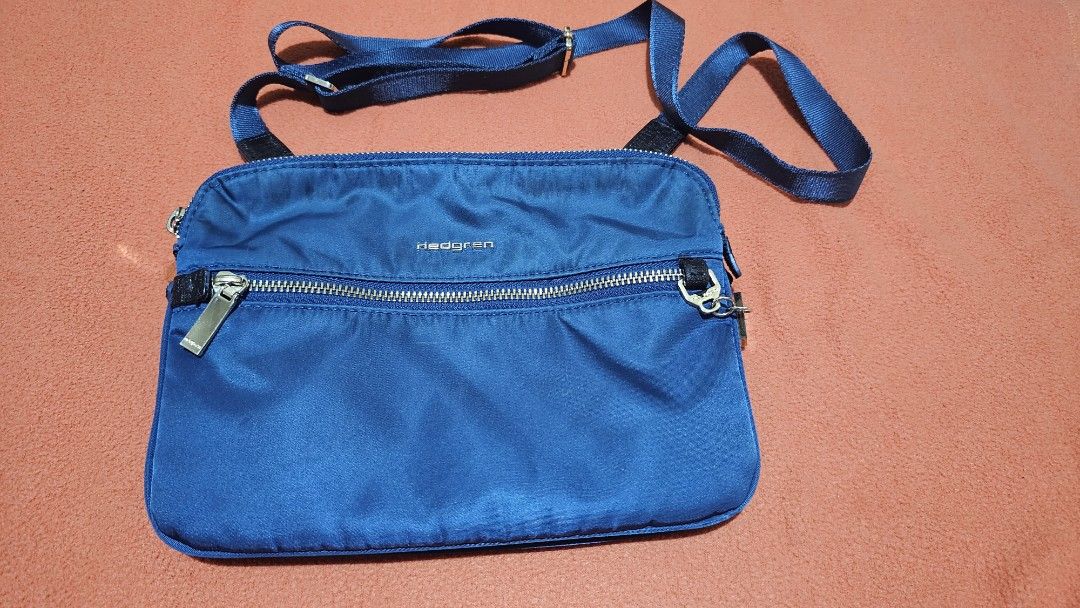 Hedgren Attraction Sling/Cross body Bag (Category: Cross-body Bags) located in Quezon City. Submitted by bagsforless16 (Listing ID 1412542300, Image 1). Description: Multi Compartment Crossover Bag Water Repellant Fabric Smart Organization Gold Hardware Lightweight Adjustable Strap 2 Main Zip Compartment Front Zip Pocket.