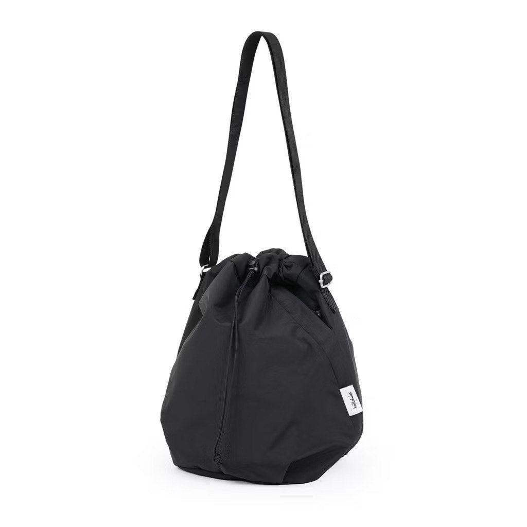 Hellolulu Cowan Crossbody Black 5L (Category: Shoulder Bags) located in Manila. Submitted by offthelabelmnl (Listing ID 1412676088, Image 1). Description: - Hellolulu Cowan Crossbody Bag - Color: Black - Capacity: 5L - Adjustable shoulder strap - Can be carried as a handheld, crossbody or shoulder bag - Front and back zippered pocket for small & versatile accessories like mobile phone and coin purse - Easy access main compartment with drawstring 