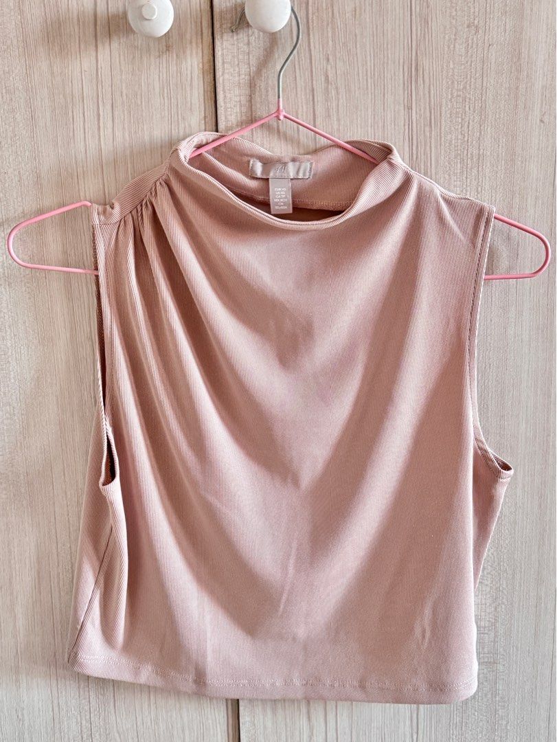 H&M Sleeveless Top - XS (Category: Sleeveless) located in Quezon City. Submitted by kaeshops (Listing ID 1412601120, Image 1). Description: - H&M Sleeveless Top - Size: XS - Style: Mock neck - Fabric: Ribbed knit - Color: Neutral - Perfect for layering.